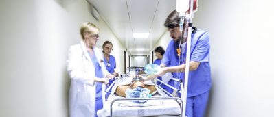 Providers with patient on gurney Getty Images 523769586