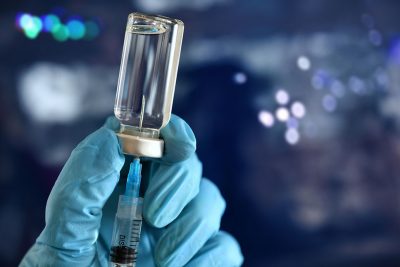 Needle and vaccine vial Getty Images 2185805652