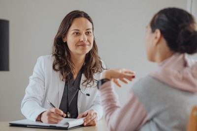 Doctor consulting with patient Getty Images 1446047237