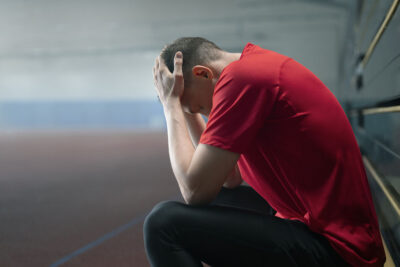 Athlete holding his head Getty Images 1892280377