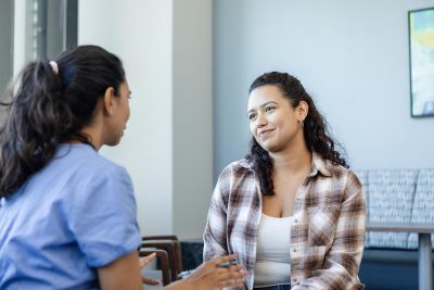 Young woman with doctor Getty Images 2185637901