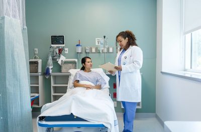Doctor with female patient in hospital Getty Images 2214748354
