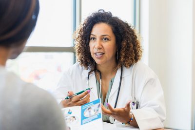 Female doctor talking to female patient Getty Images 1342134439