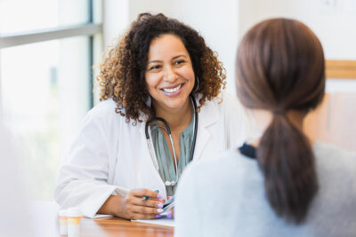 Doctor talking with woman patient Getty Images 1342134434