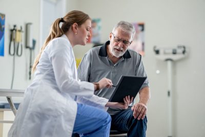 Doctor with older adult patient Getty Images 2048635835