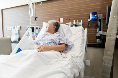 Female patient in hospital bed Getty Images 1945089044