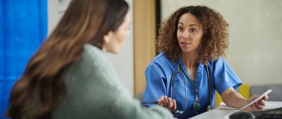 Physician talking with patient Getty Images 1401342653