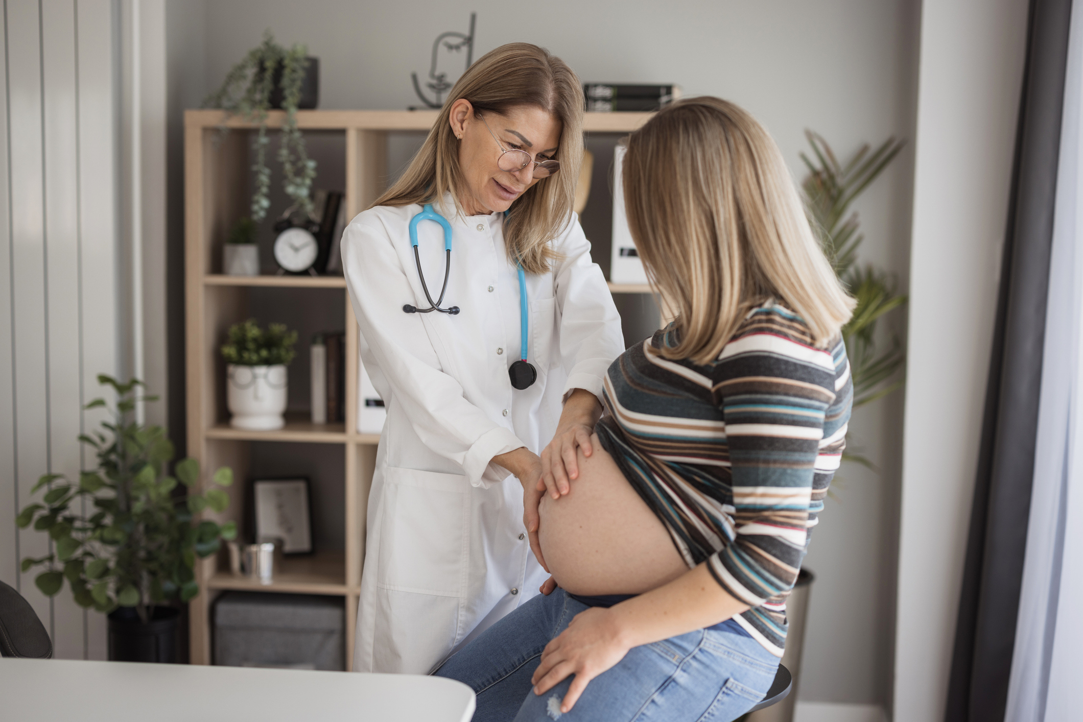 Clinician and pregnant woman