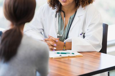 Doctor consulting with female patient Getty Images 1345513629