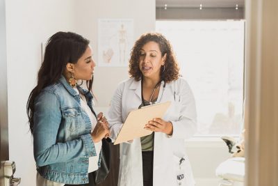 Female pt with doctor Getty Images 1293681745