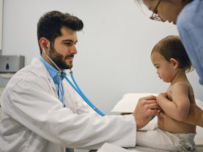 Pediatric resident and patient Getty Images 1325475078