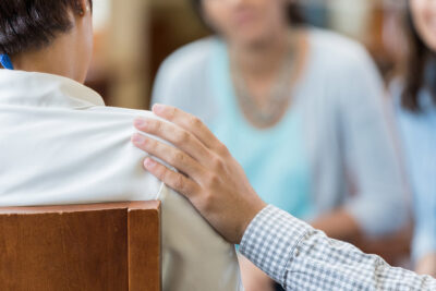 Supportive hand on shoulder Getty Images 962642002