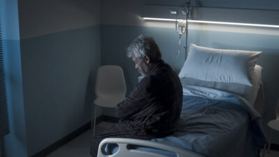 Older man alone in hospital room Getty Images 1208156234
