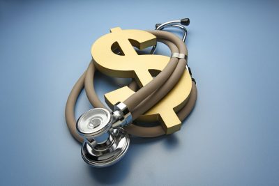 Dollar sign and stethoscope Getty Images 1153554528