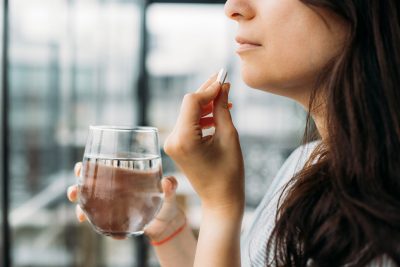 Woman taking medication Getty Images 1499412158
