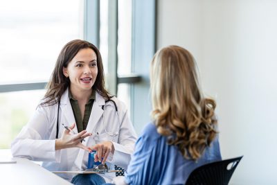 Doctor talking with female patient Getty Images 2184805835