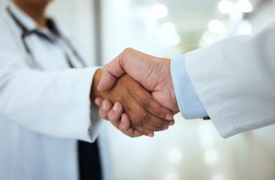 Two doctors shaking hands
