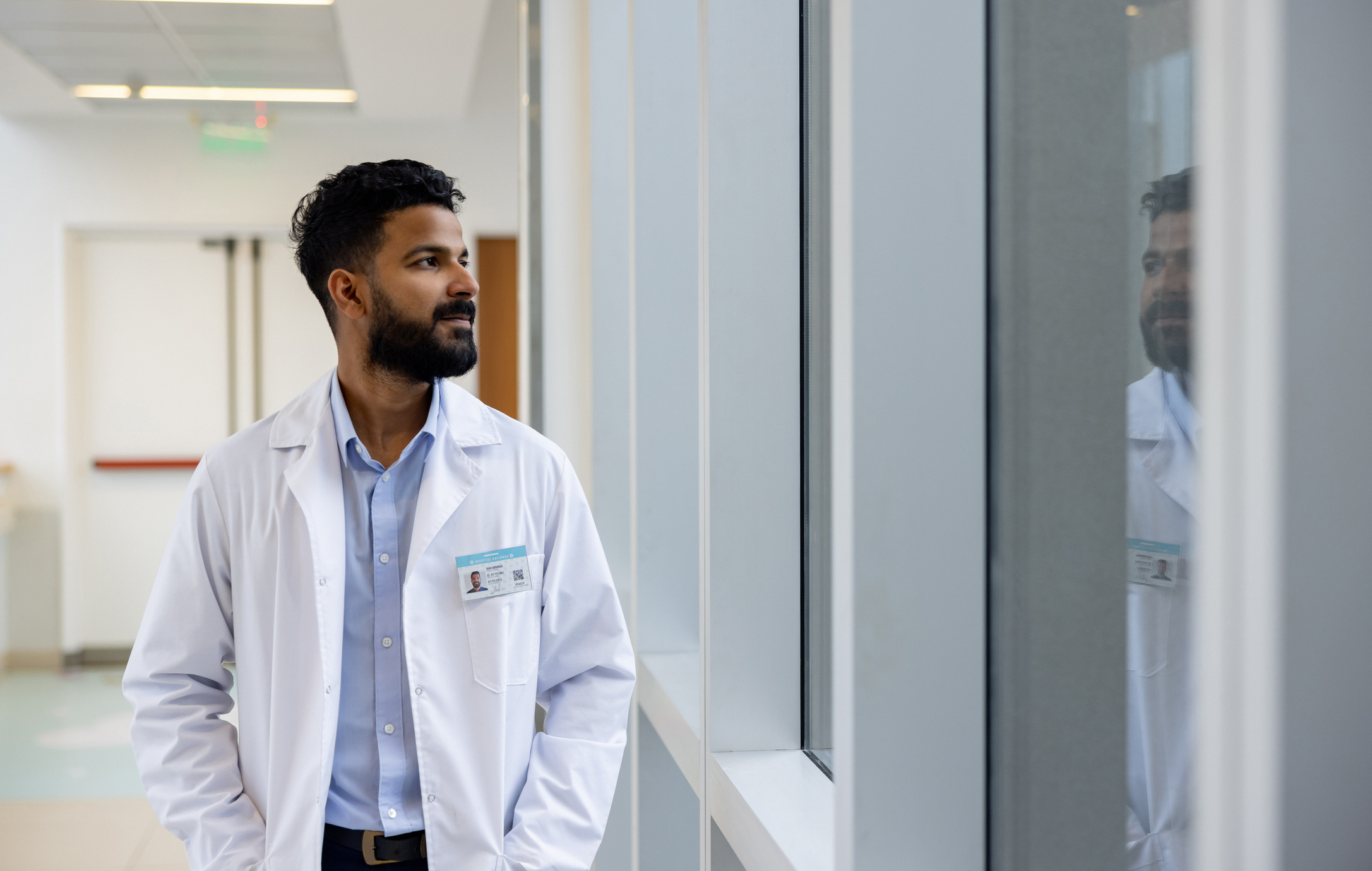 Doctor looking out window